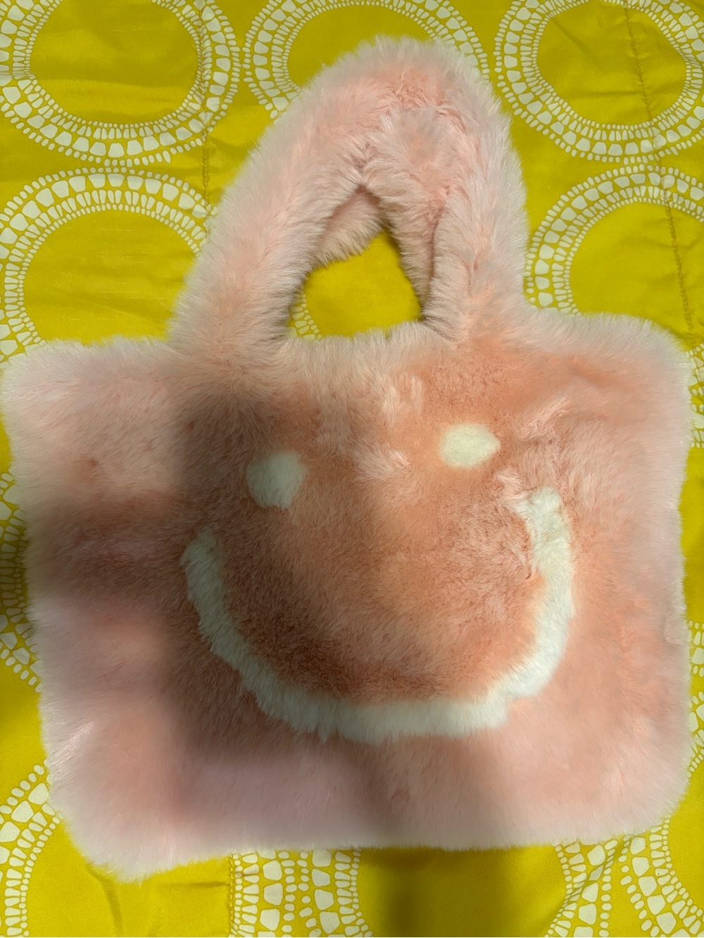 Danbar pink faux fur tote bag with white smiley face